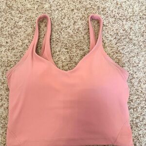Light pink women’s Lululemon workout top